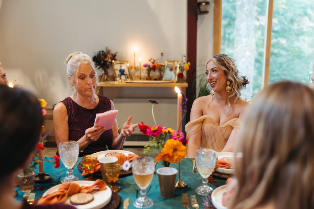 mother of the bride reading a speech during their Vermont elopement celebration 