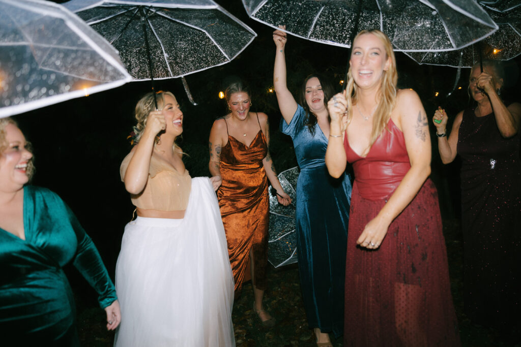 bride and bridesmaids celebrating after her wedding in Vermont