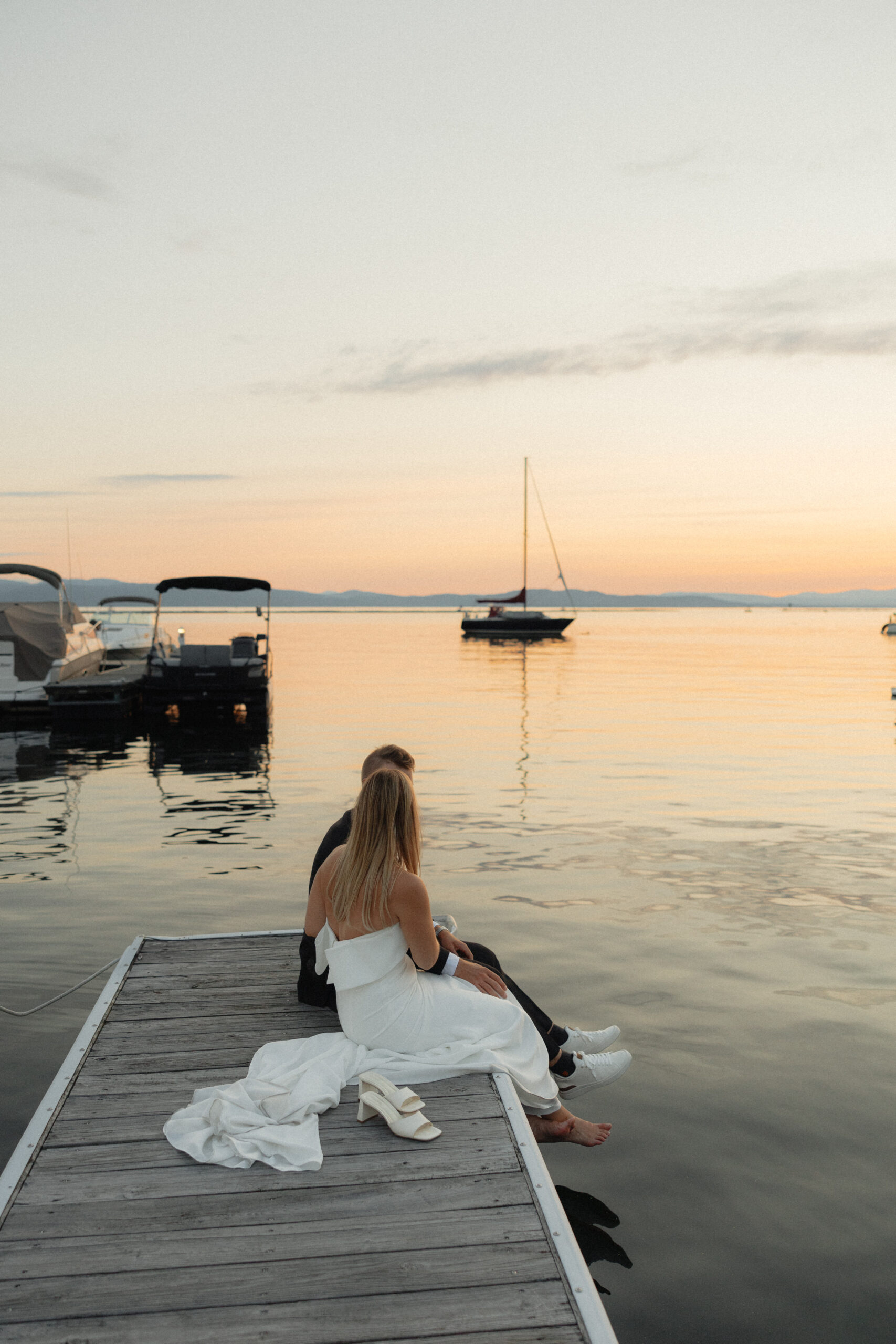 couple sitting together at waterfront park in burlington vermont