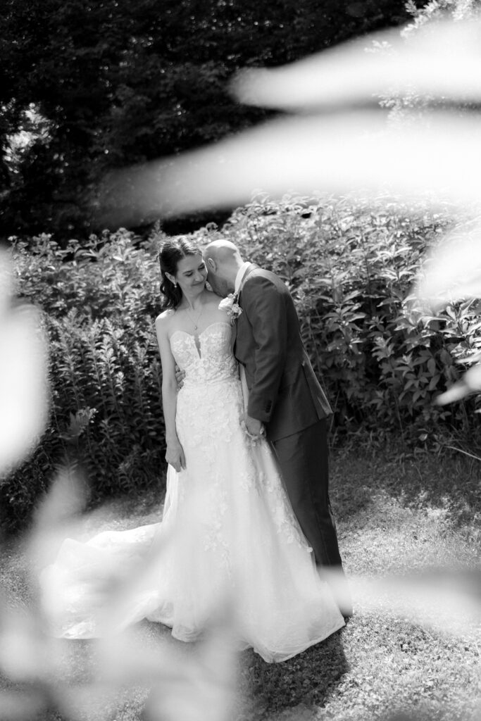 BRIDE AND GROOM AT THEIR VERMONT WEDDING AFTER THEIR FIRST LOOK DURING AN INTIMATE MOMENT TOGETHER