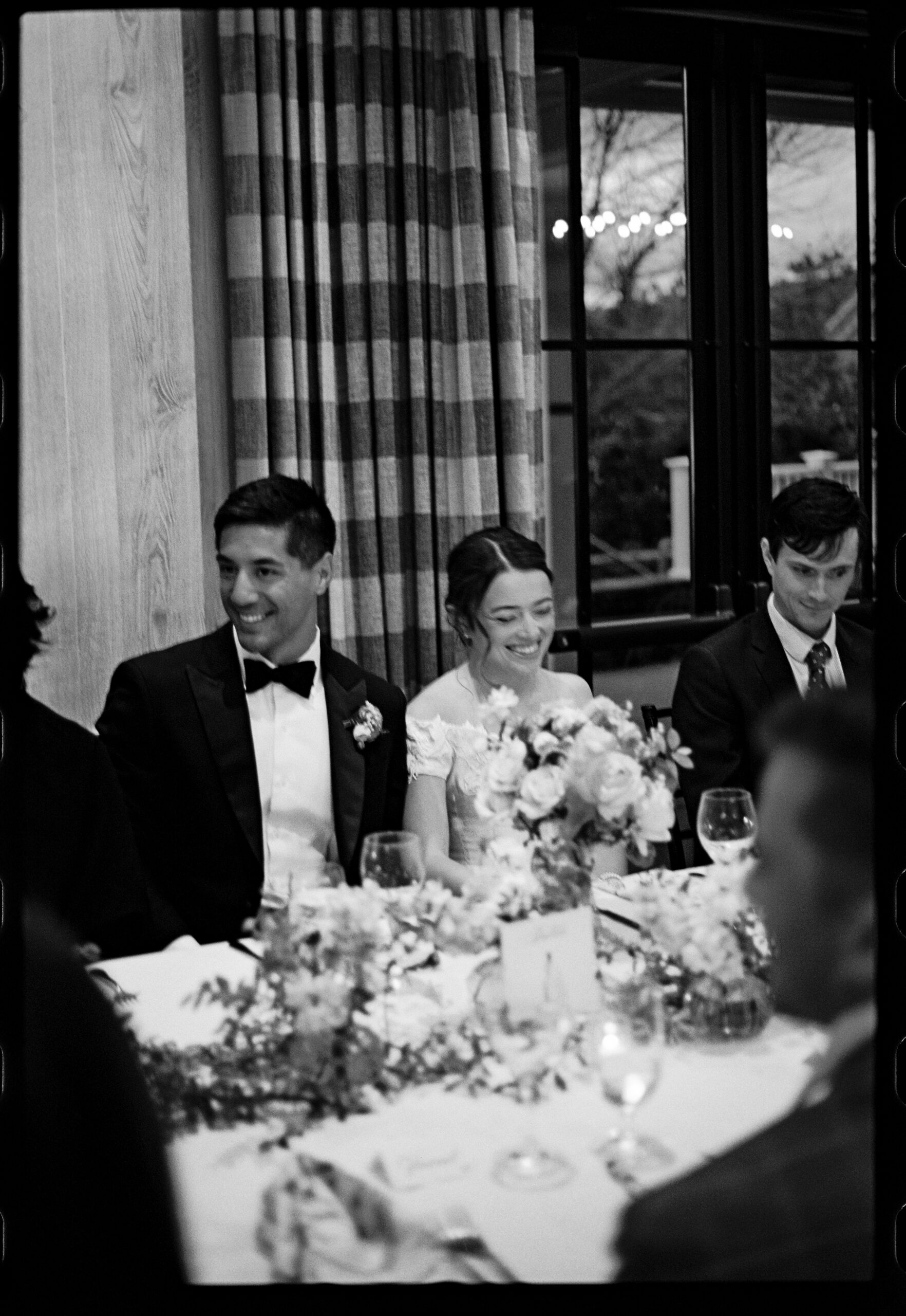 Bride and groom laughing during their reception in Manchester Vermont