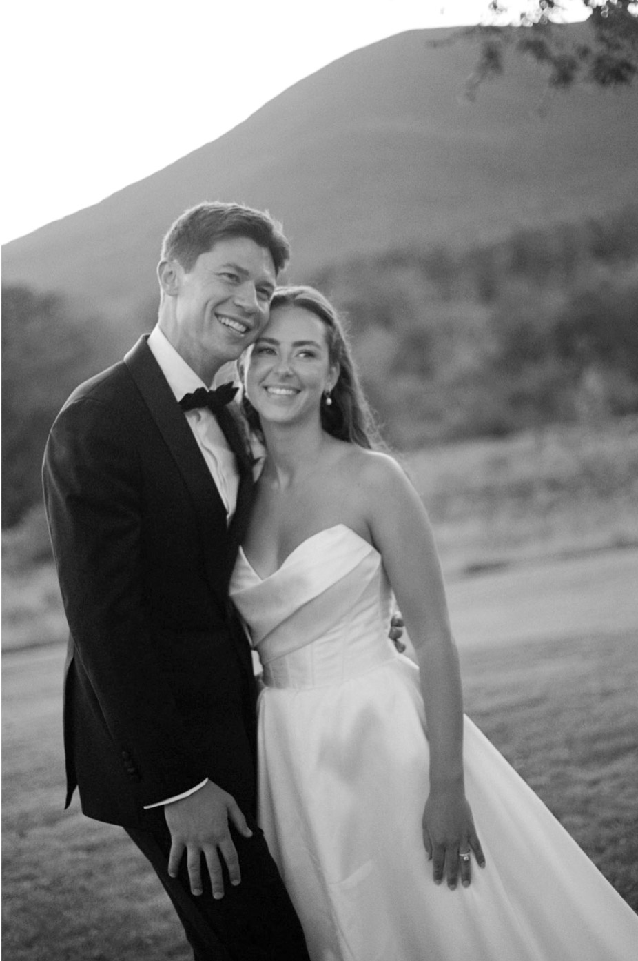 Bride and groom smiling in the formal gardens during their Hildene wedding in Manchester, Vermont