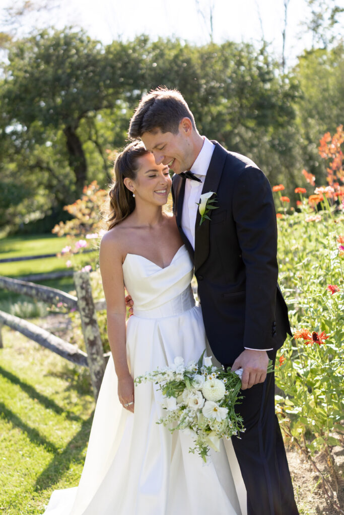 bride and groom wedding portrait outside on sunny summer day in vermont 